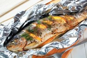 Grill Fish In Foil Wrapped with Vegetable and Provisions